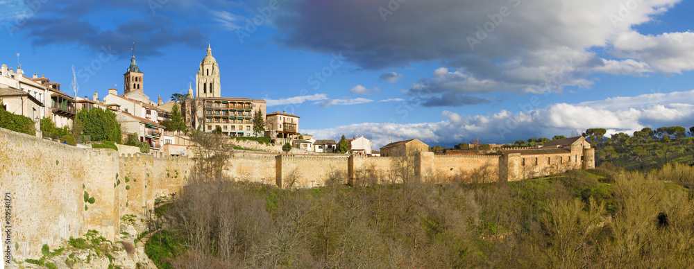 Segovia - The panorama of the Town walls and the cathedral tower in the background.
