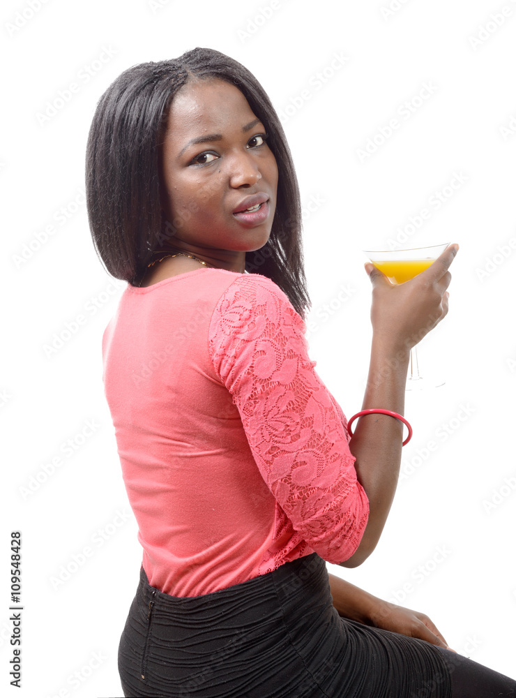 beautiful African woman drinking orange juice beautiful African woman drinking orange juice