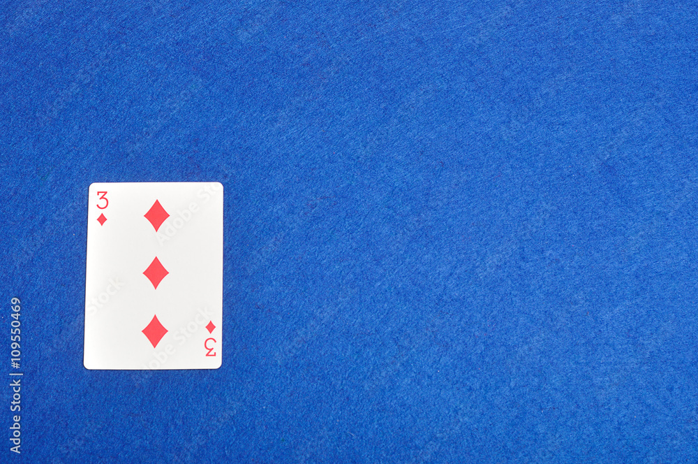 Playing card. Three of diamonds isolated on a blue background