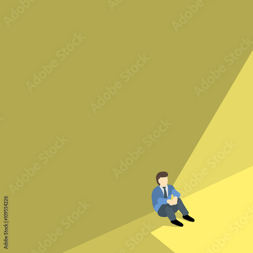 business man sitting alone against shadow wall with copyspace. photo