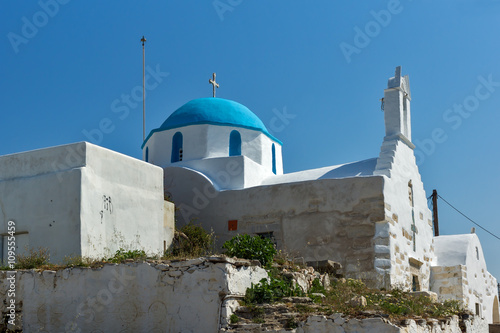 White chuch with blue roof in town of Parakia, Paros island, Cyclades, Greece photo