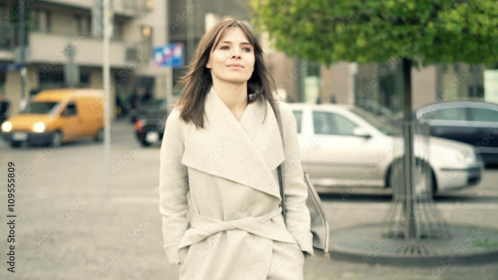 Young, happy woman walking in city
Young, happy woman walking in city
