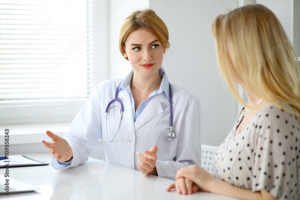 Doctor and patient are discussing something Doctor and patient are discussing something