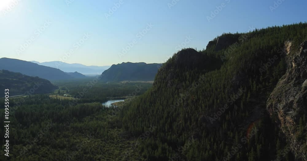 Aerial Shot of open rangeland with forest and mountains. Altai, Siberia. Kurai Steppe. Aerial Shot of open rangeland with forest and mountains. Altai, Siberia. Kurai Steppe.