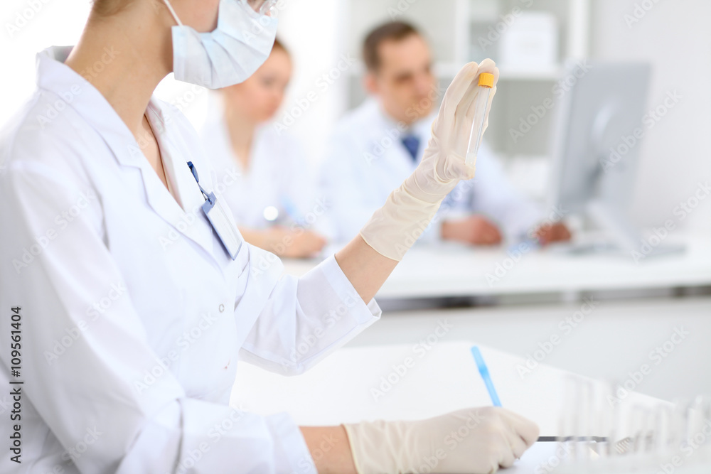 Scientific research team with clear solution in laboratory Scientific research team with clear solution in laboratory