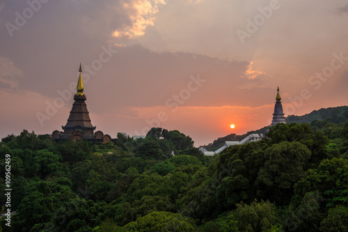 scene of a sunset at two pagoda on the top of Inthanon mountain,