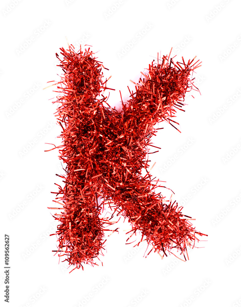 Naklejka premium Tinsel Christmas decoration in form of K. On a white background