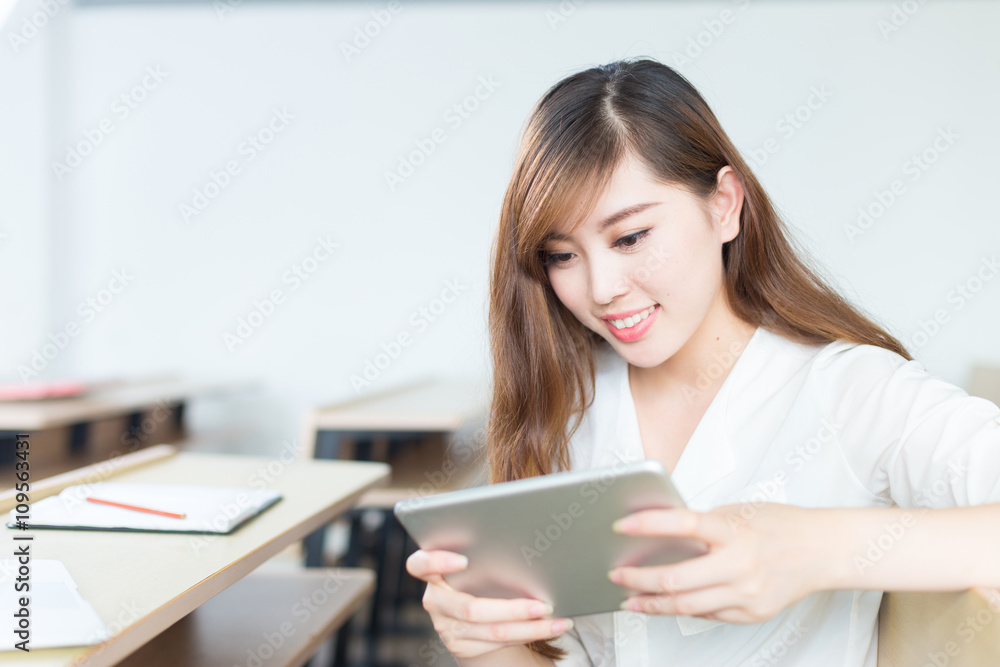 young beautiful asian girl student in classroom young beautiful asian girl student in classroom