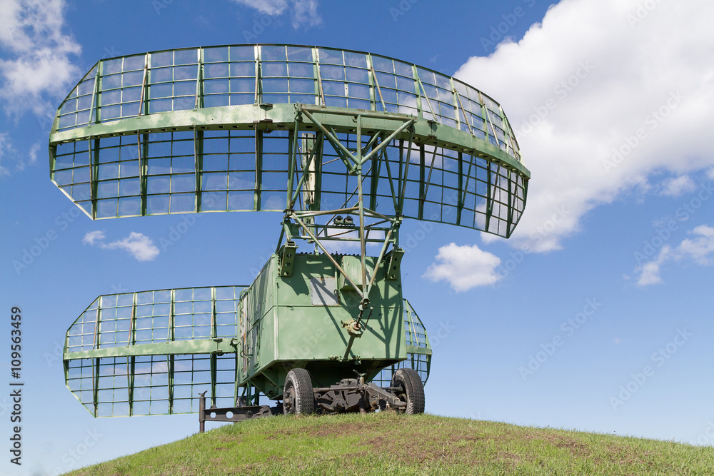 military equipment radio radars in blue sky.