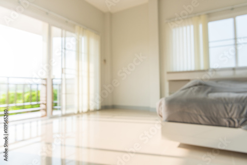 blur of light shines through white curtains in room