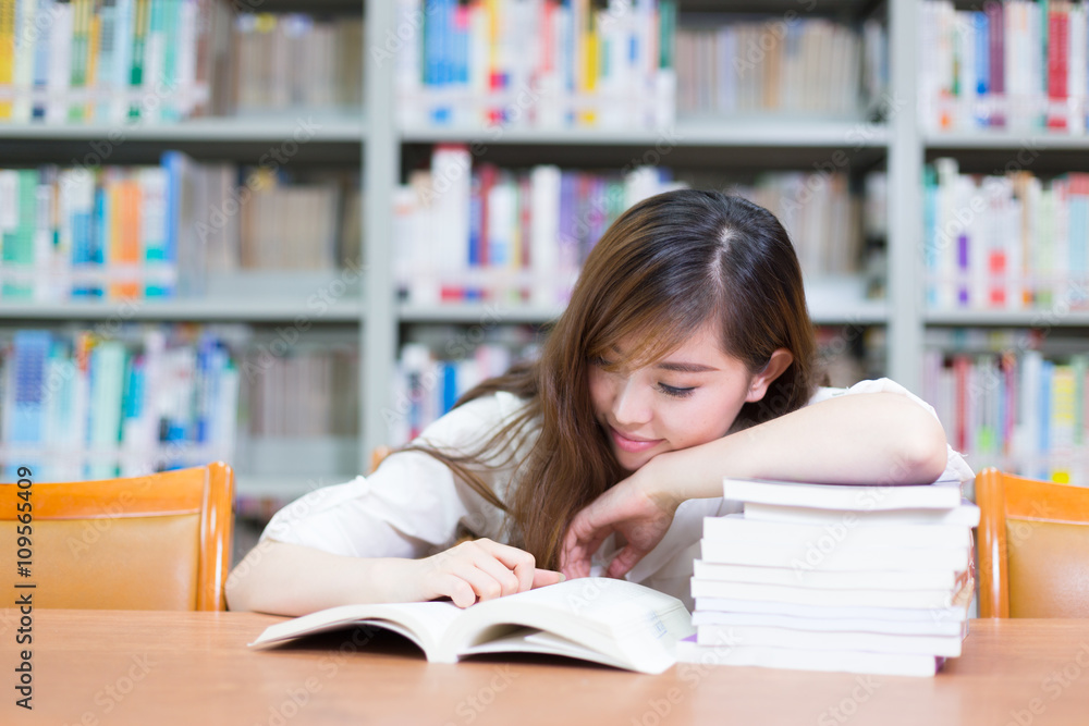 young beautiful asian girl in school library young beautiful asian girl in school library