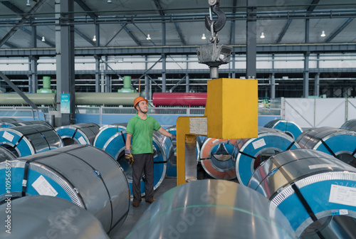 Worker in solar panel assembly factory, Solar Valley, Dezhou, China