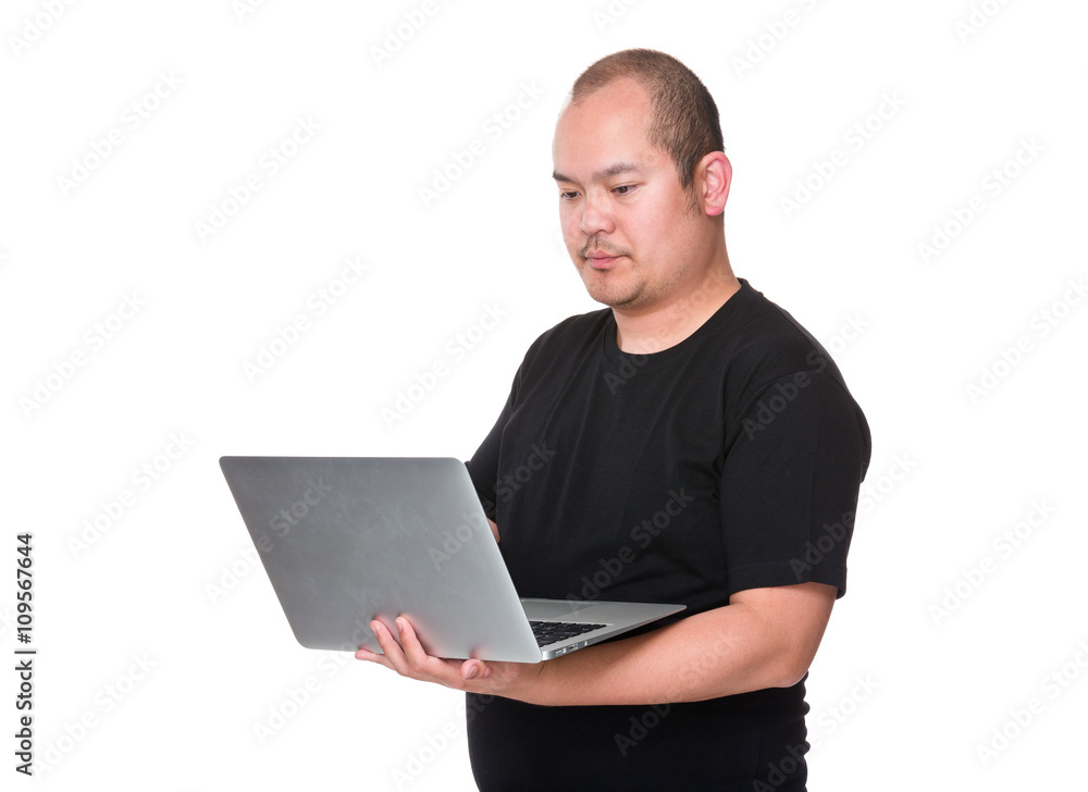 Man holding laptop computer Man holding laptop computer