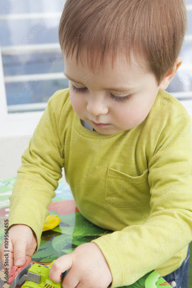 Baby boy playing with toys at home Baby boy playing with toys at home
