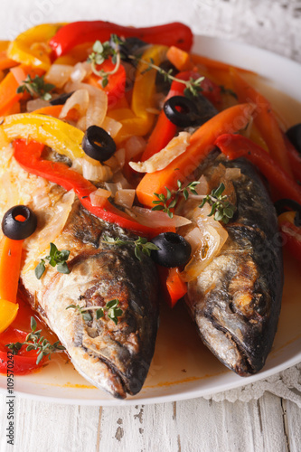 Spanish cuisine: escabeche of mackerel closeup. Vertical
 photo