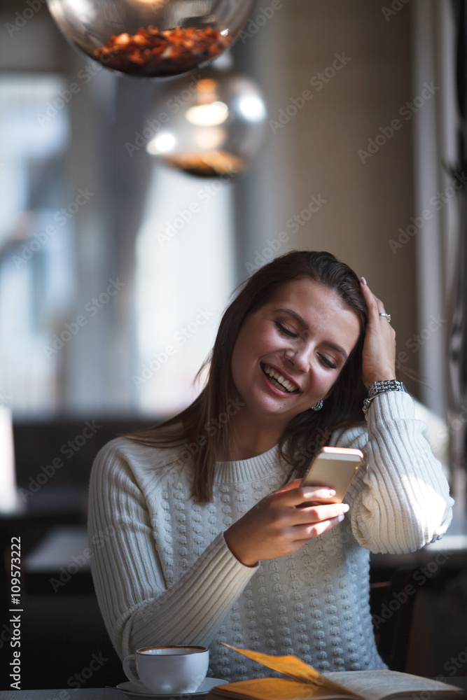 woman using her mobile phone at cafe woman using her mobile phone at cafe