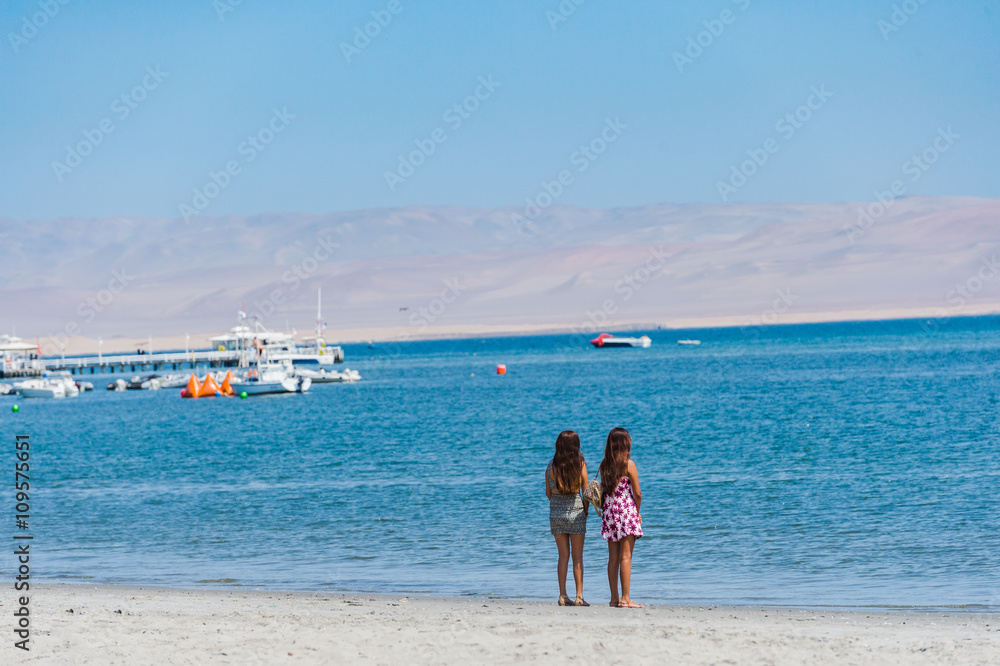 Sweer Lonely girl stand on the beach with dessert moutain view, Sweer Lonely girl stand on the beach with dessert moutain view,