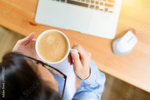 Top view of woman drink of coffee