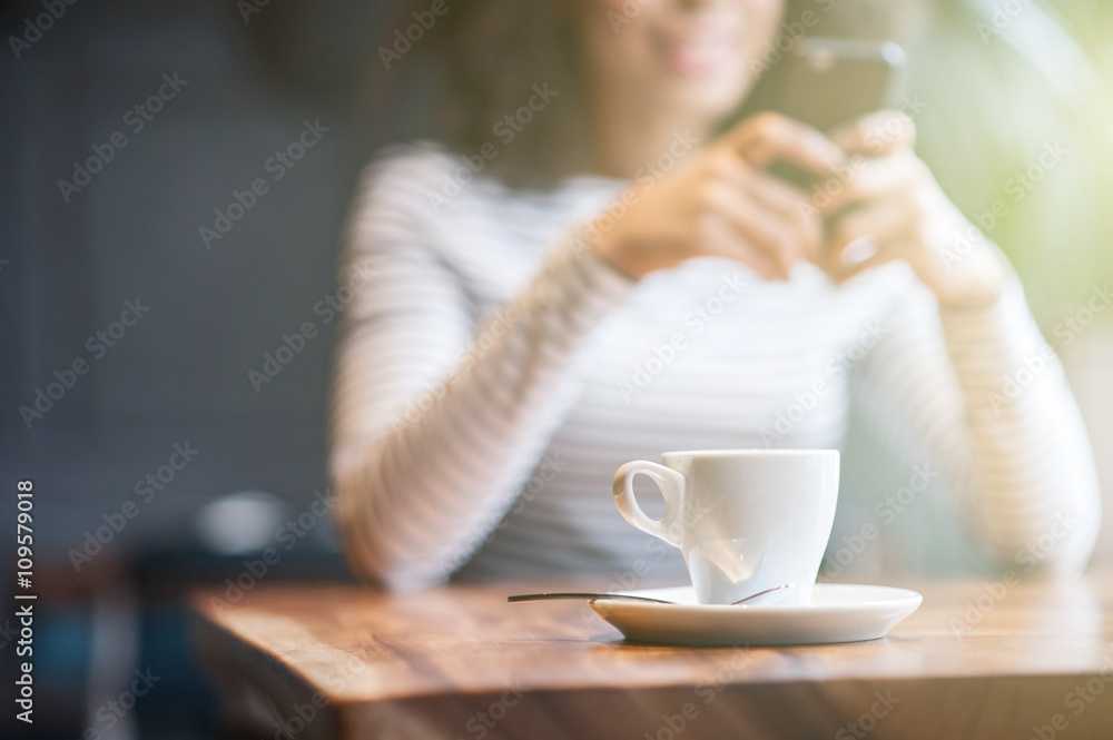 Pretty african woman is using telephone in cafe Pretty african woman is using telephone in cafe
