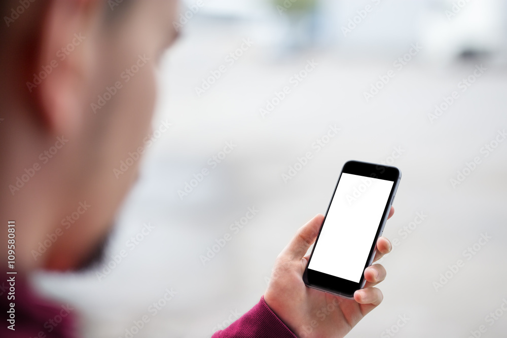 Man using mobile smartphone. - purple sweater, shot with third-person view, blank screen, mockup template Man using mobile smartphone. - purple sweater, shot with third-person view, blank screen, mockup template
