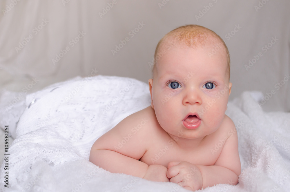 baby is hiding under the white blanket baby is hiding under the white blanket