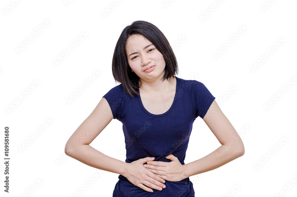 Asian woman suffering from severe pain in her tummy on white Asian woman suffering from severe pain in her tummy on white