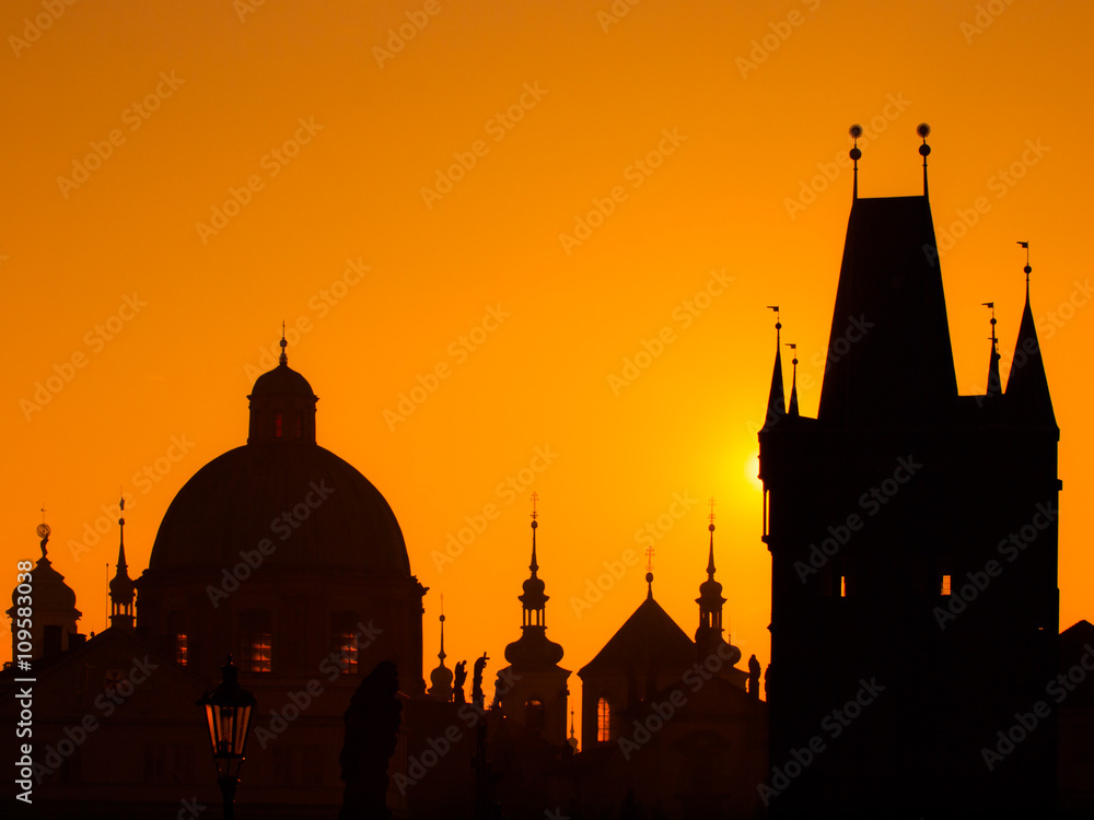 Silhouettes of towers and statues in Prague Old Town