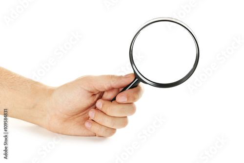 Male hand holding magnifying glass on a white background