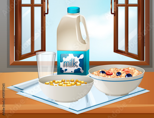 Breakfast on table with milk and cereal