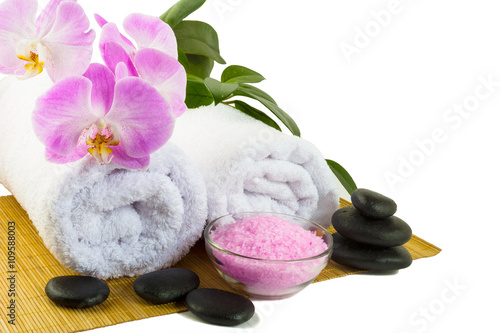 Spa concept with pink orchid isolated on white