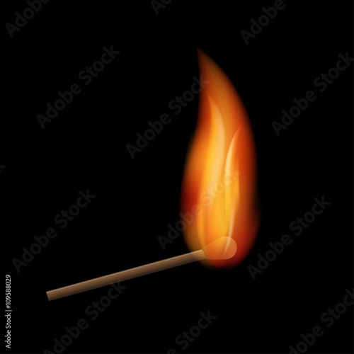 Burning match on a black background