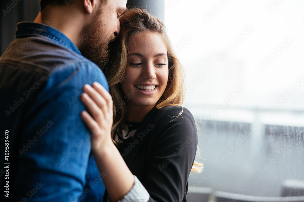 Happy couple hugging and sharing emotions Happy couple hugging and sharing emotions