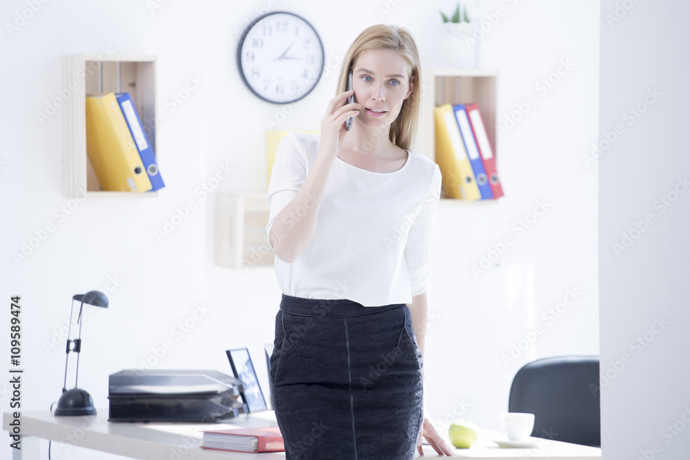 Beautiful young business woman in office