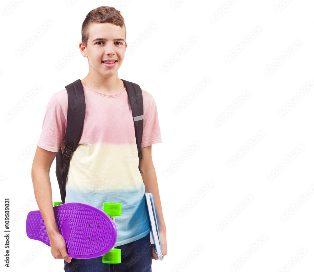 Portrait of a school boy holding a skateboard and notebooks, iso Portrait of a school boy holding a skateboard and notebooks, iso