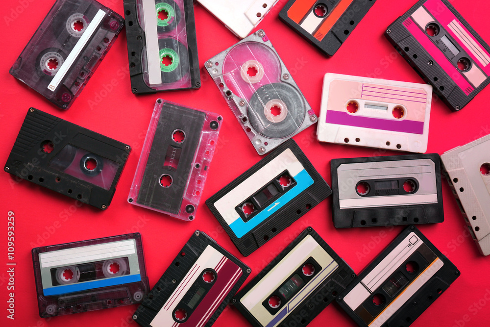 Set of old audio cassettes on red background Set of old audio cassettes on red background