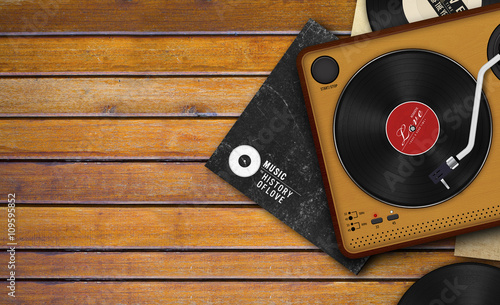 Photography record player and vinyl record on wooden background