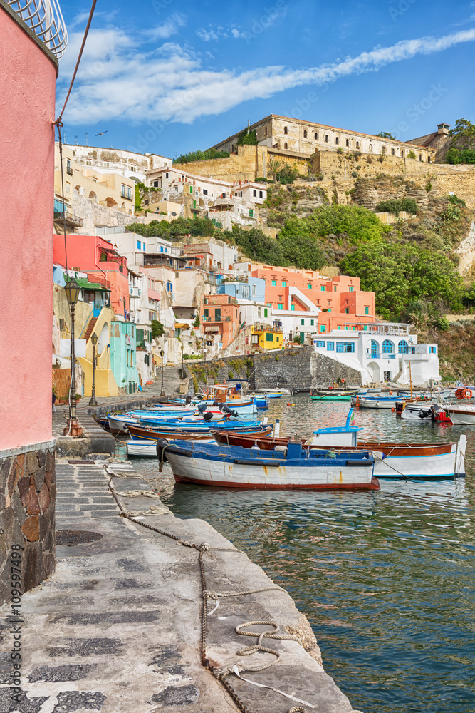 Picturesque landmark in Italy with fishing-boats and pastel coloured buildings.