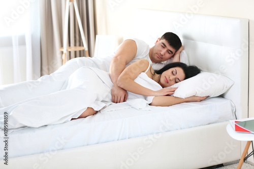 Lovely couple sleeping in w...