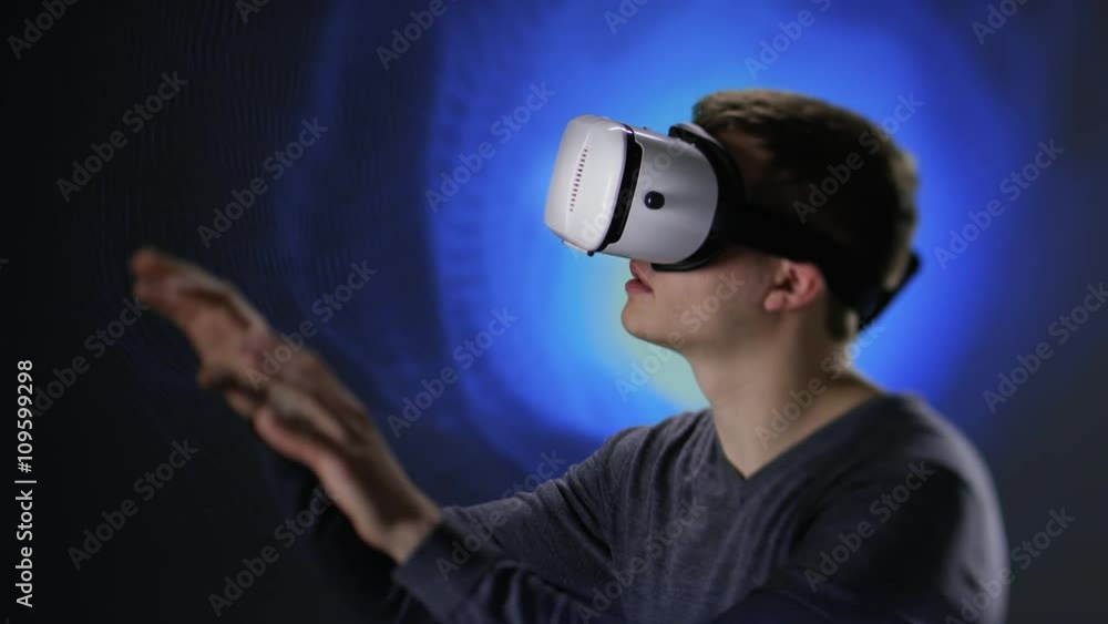 Young man exploring new virtual world Young man exploring new virtual world