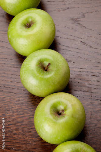 green apples arranged in a row