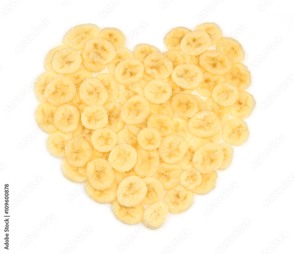 Banana slices folded in the form of heart, isolated on white Banana slices folded in the form of heart, isolated on white