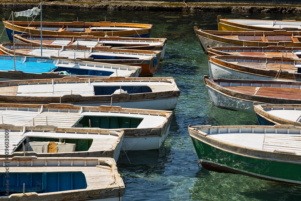 Traditional wooden fishing-boats moored in the mediterranean sea.
