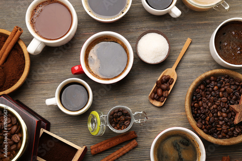 Assorted fresh coffee with spices on wooden table, top view © Africa Studio