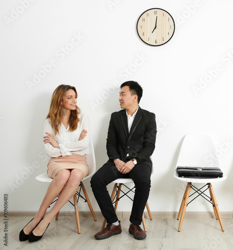 Man and woman waiting for i...