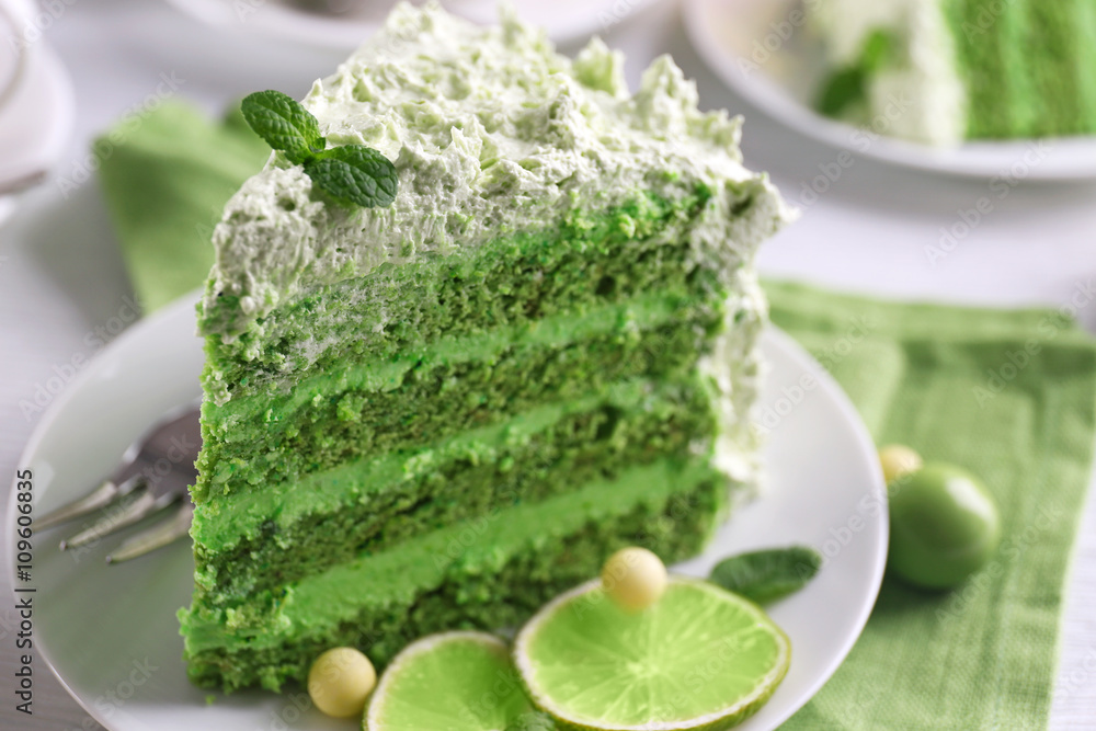 Piece of delicious creamy lime cake on saucer closeup Piece of delicious creamy lime cake on saucer closeup