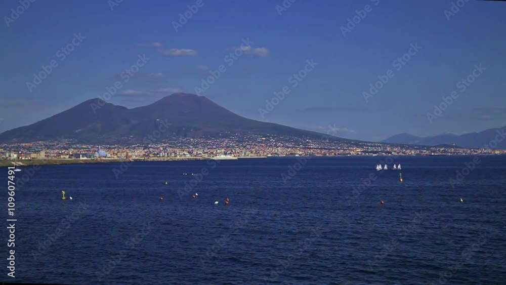 A timelapse of vesuvius mount and Napoli bay, in a clear, vivid day, with many boats in fast movement A timelapse of vesuvius mount and Napoli bay, in a clear, vivid day, with many boats in fast movement