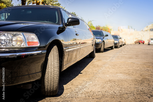 Canvas Print Three black limousines in a row.