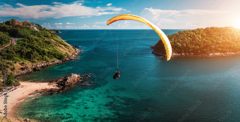 Skydiver flying over the water - obrazy, fototapety, plakaty 