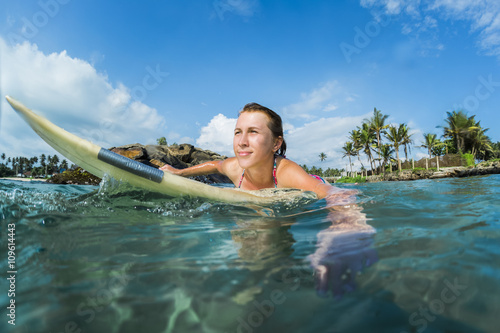 Young lady surfer