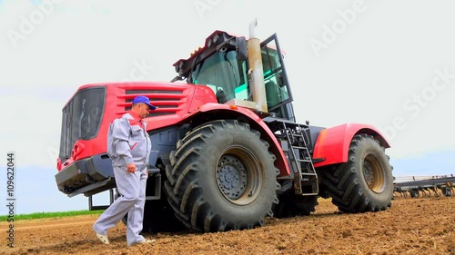 sit in a tractor on the field